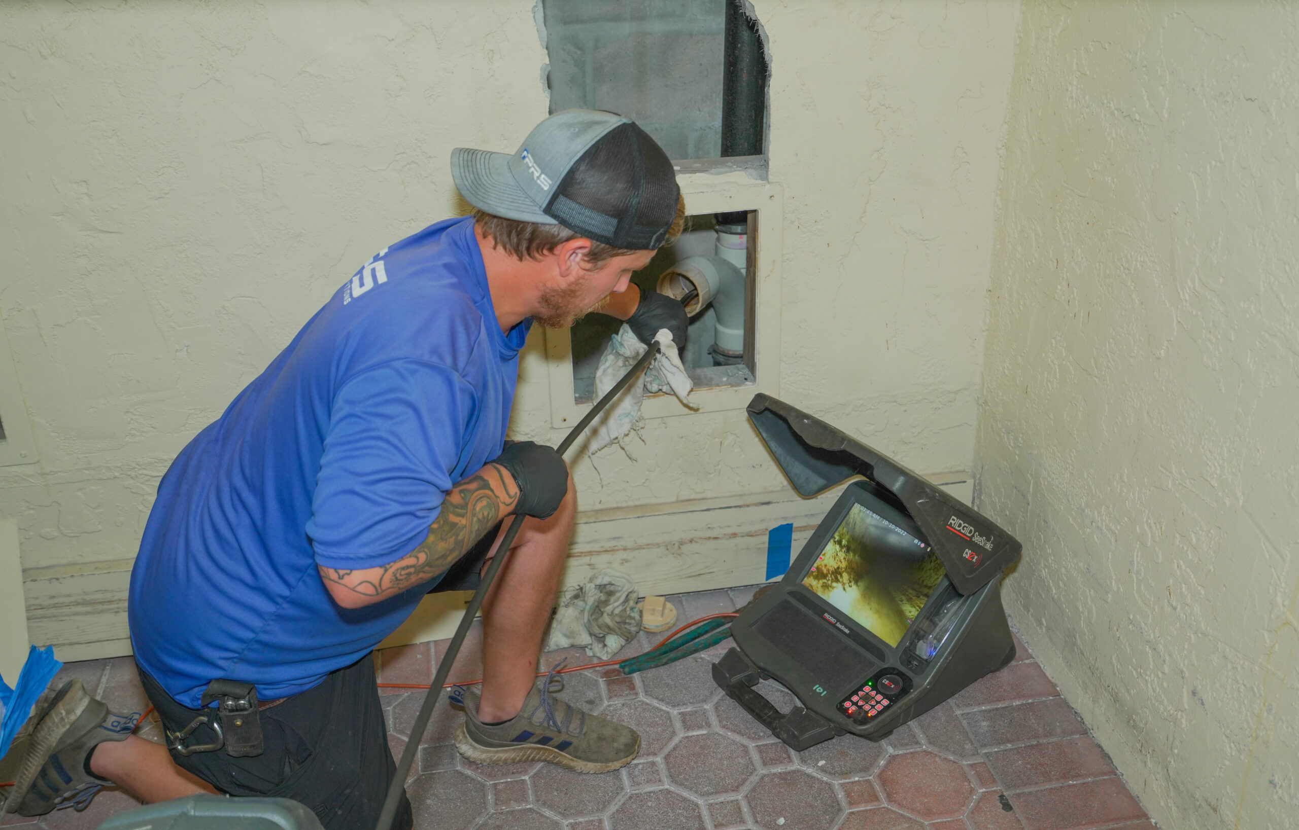 PRS technician performing pipe inspection services in Florida