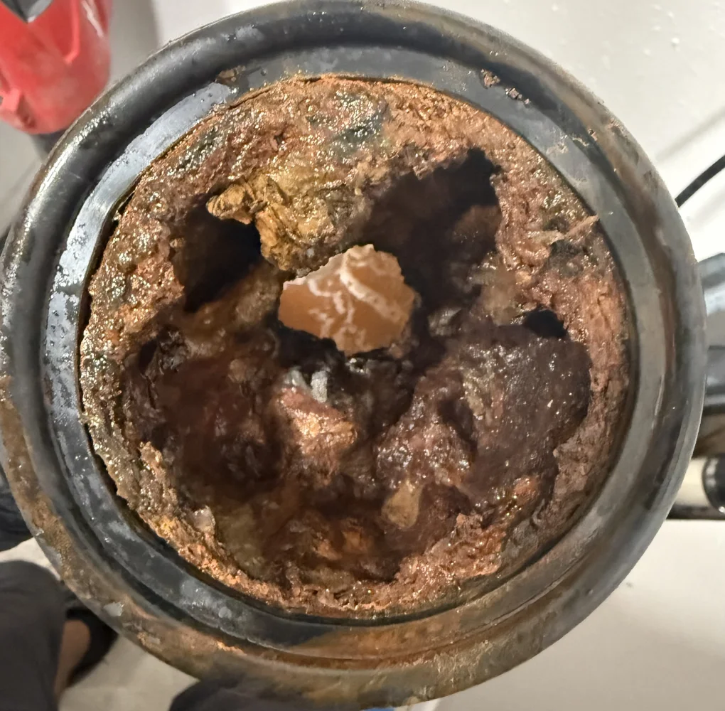 Clogged pipe before drain cleaning in Tampa, FL