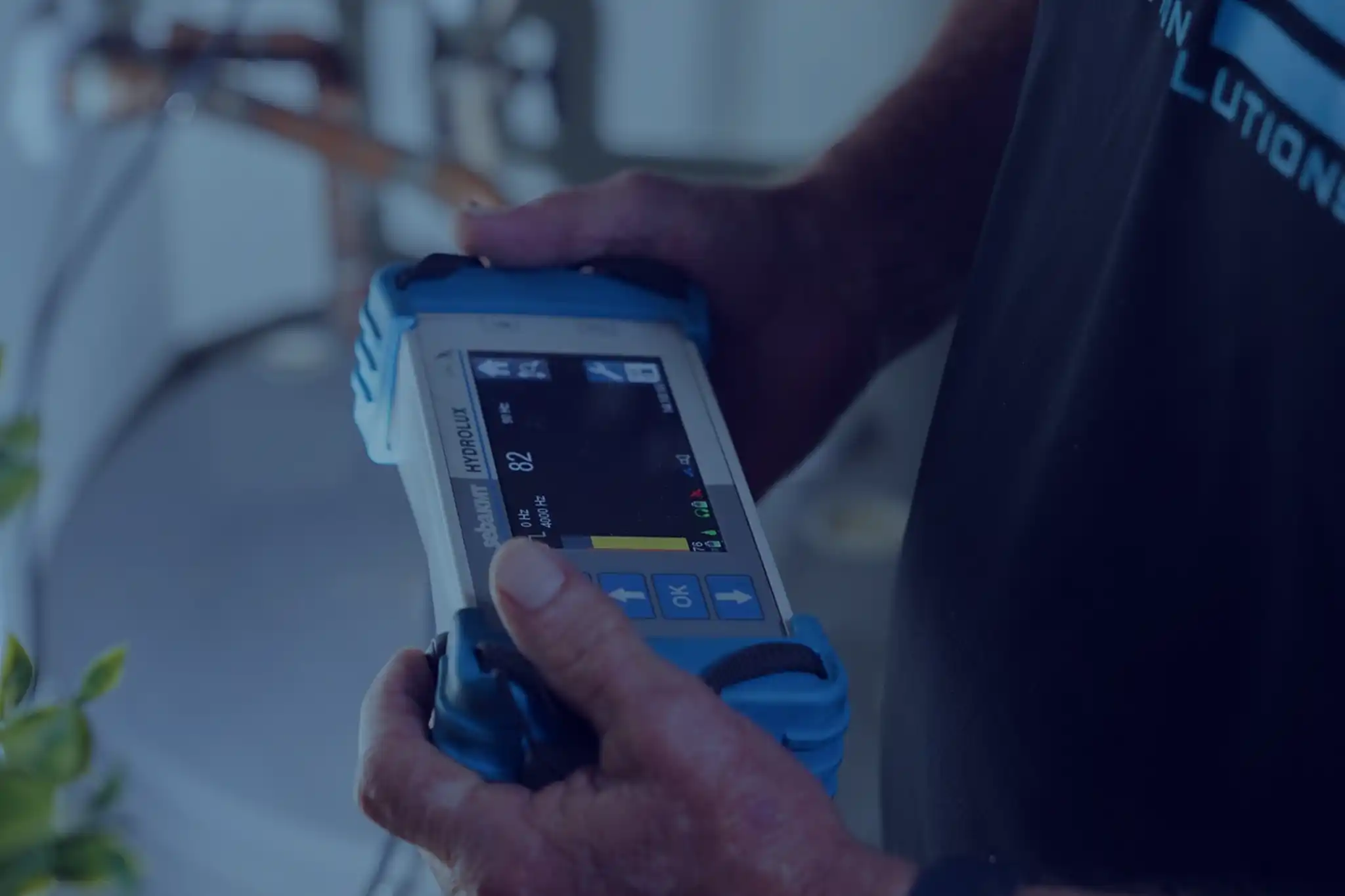 PRS technician performing ultrasonic leak detection services in Sarasota, FL