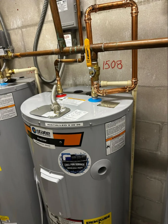 PRS technician performing water heater repair in Sarasota, FL